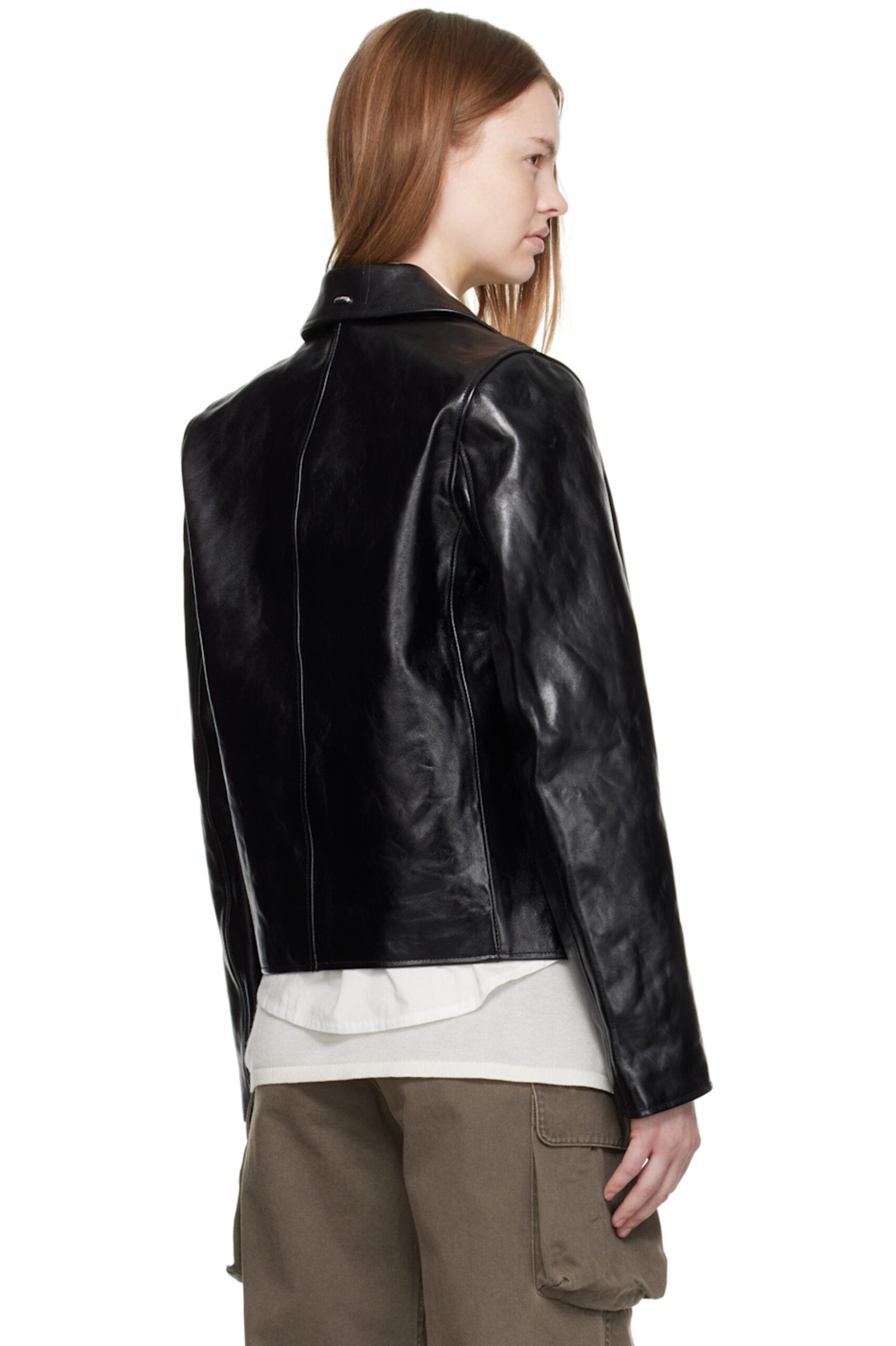 Back profile of the women's cropped leather jacket demonstrating the modern, oversized streetwear silhouette and heavy drape