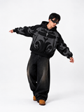 Male model styling the heavyweight black Exotix depth hoodie, demonstrating the premium loosefit drape for winter
