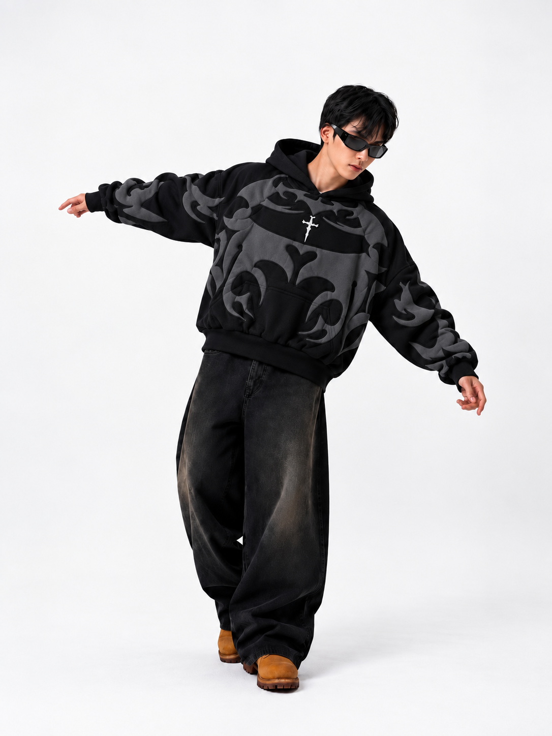 Male model styling the heavyweight black Exotix depth hoodie, demonstrating the premium loosefit drape for winter