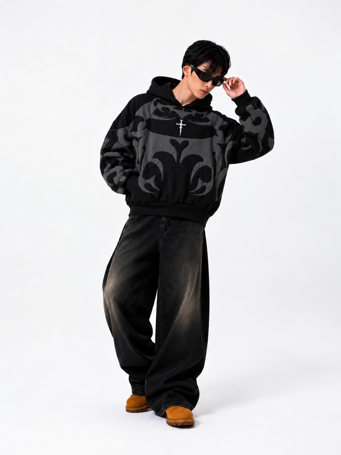 Lifestyle shot of a boy wearing the 400 GSM black fleece hoodie, highlighting the clean stringless hood