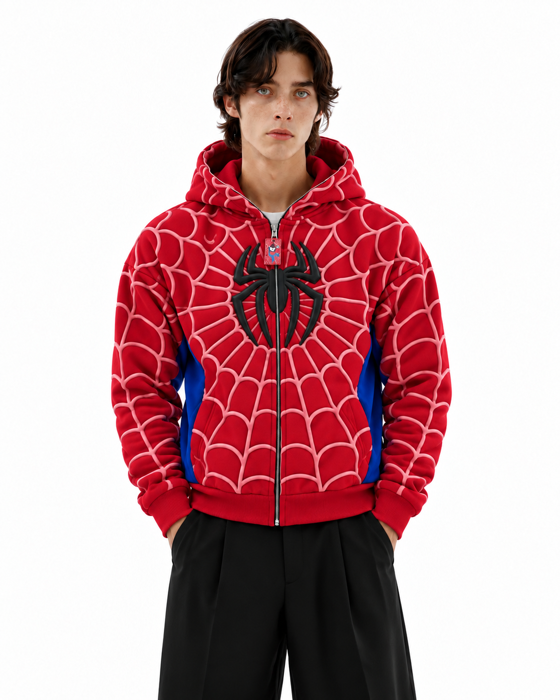 Male model wearing the oversized Red Exotix Spidey Zip-Up Hoodie, showcasing the Marvel streetwear aesthetic and puff print design