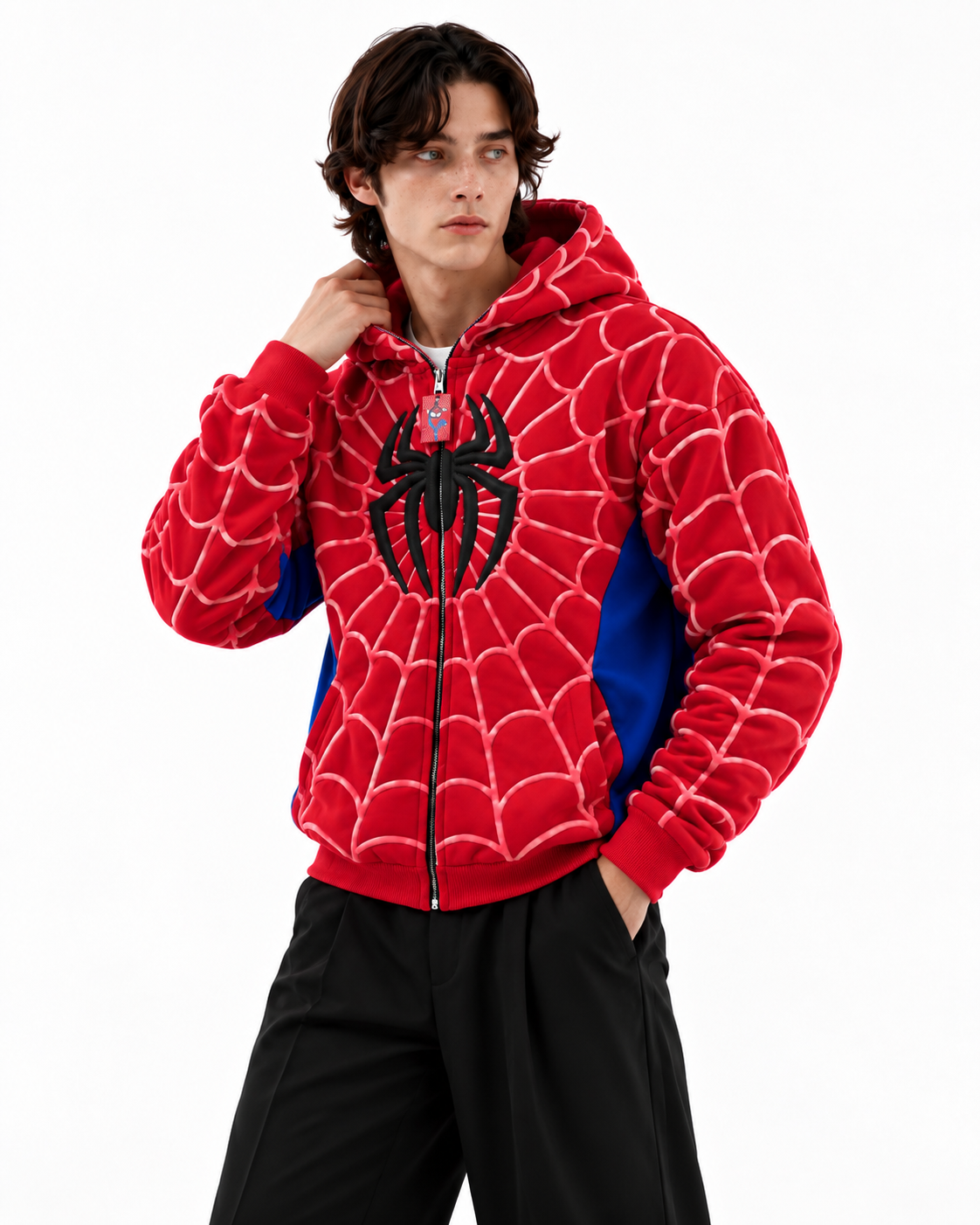 Back/side view of the male model in the red Marvel streetwear hoodie, demonstrating the relaxed drop-shoulder fit
