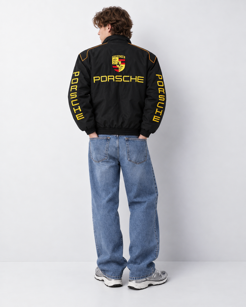 Back view of the oversized Porsche motorsport jacket, showcasing the large 100% threadwork embroidery across the shoulders