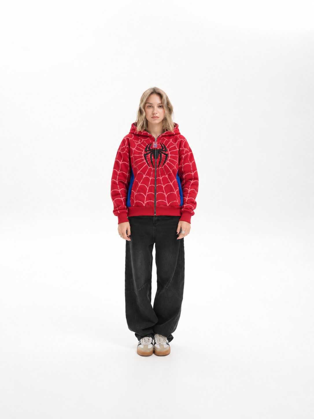 Close styling view of a woman wearing the red Marvel zip-up hoodie, focusing on the premium 350-400 GSM fabric texture
