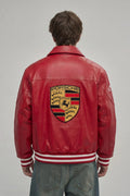 Back profile demonstrating the bold motorsport embroidery and structured cropped silhouette on the men's racing jacket