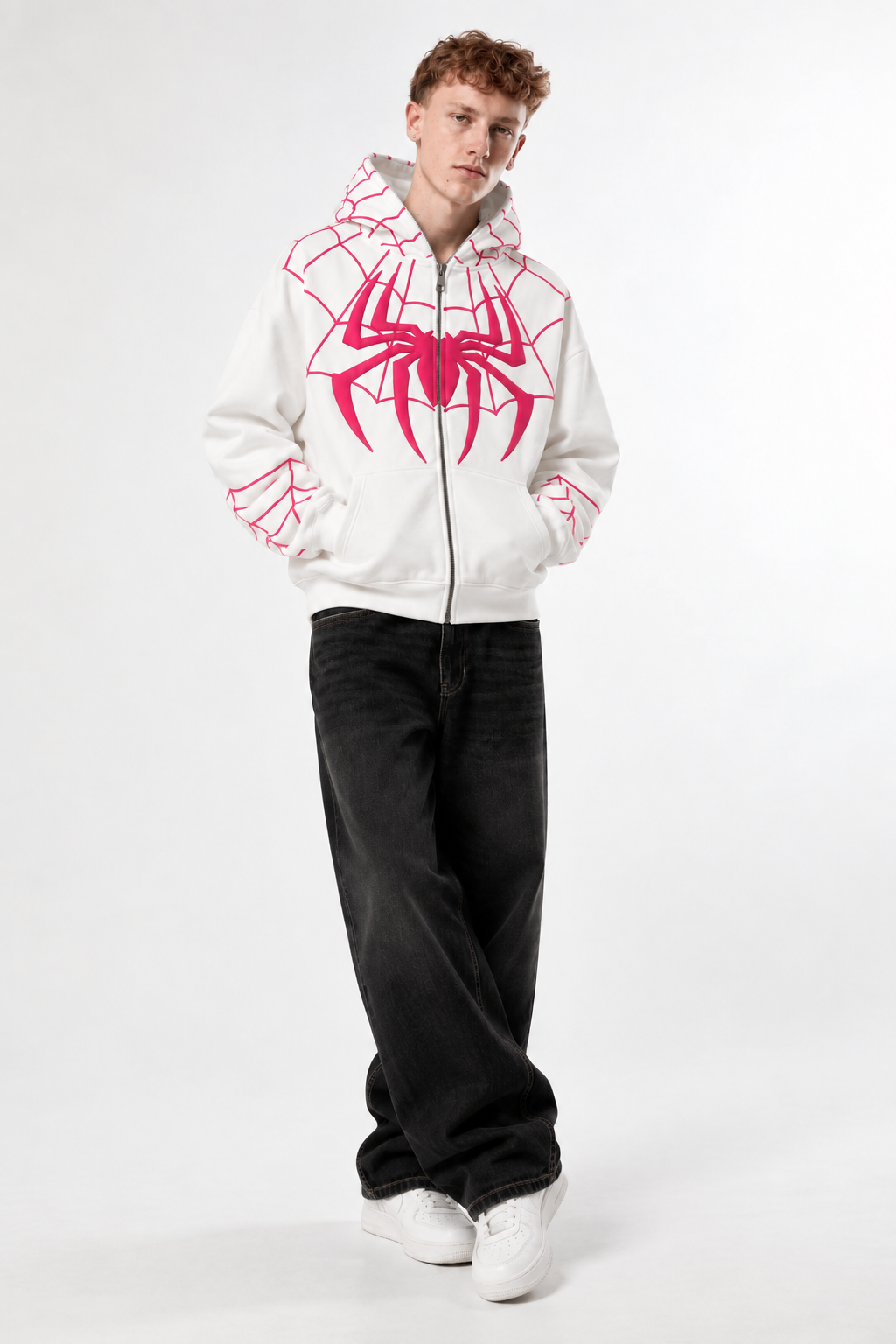 Close up of a boy wearing the 350 GSM heavyweight fleece Spidey hoodie, showing the 3D puff print and full-face zipper detail
