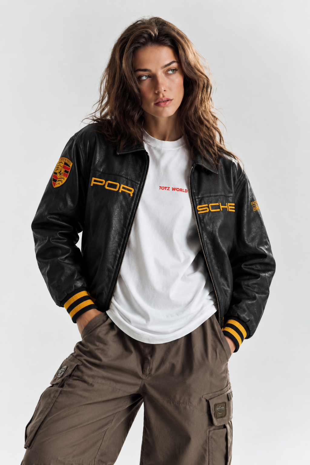 Front styling view of a girl wearing the unisex Black Porsche Leather Jacket, demonstrating the versatile Y2K streetwear aesthetic