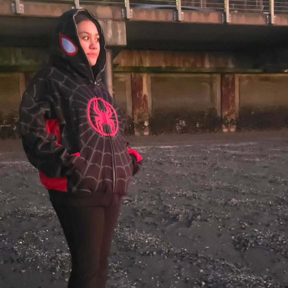 Female model wearing the oversized Black Spidey Zip-Up Hoodie, demonstrating the unisex appeal and comfortable streetwear fit