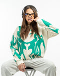 Female model wearing the vintage cream Depth oversized puff print hoodie, showcasing the boxy Y2K streetwear fit