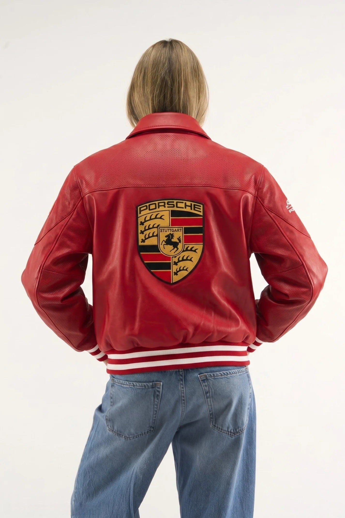 Female streetwear lifestyle look featuring the premium textured red faux-leather racing jacket