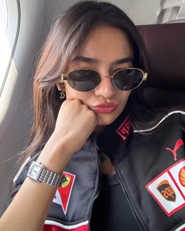 "Anushka Sen wearing the Racing Icon Black Ferrari F1 Jacket, posing stylishly