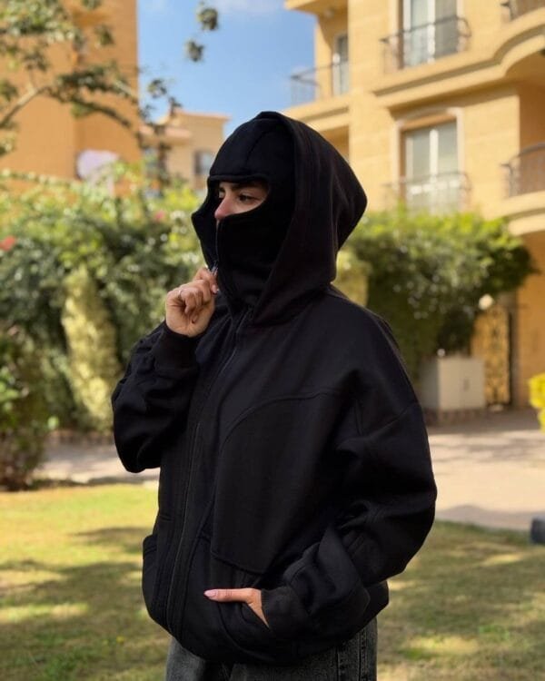 Side profile of the Unisex Ninja Black Balaclava Hoodie with the hood down