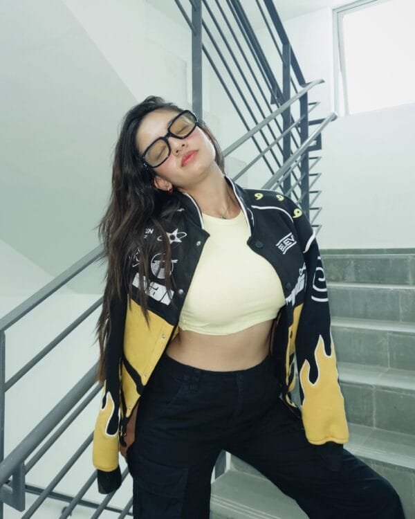 Anushka Sen in mid-action wearing the Naruto Flame Patch Jacket – streetwear aesthetic