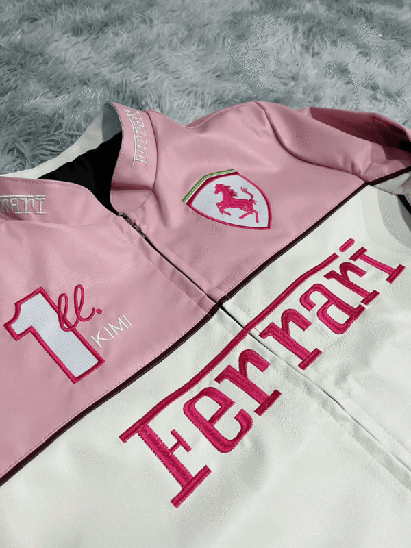 Model wearing the Limited Edition Pink Ferrari Leather Jacket in an urban setting, emphasizing its modern and stylish appeal
