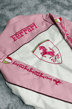 Close-up of premium Italian leather texture on the Limited Edition Pink Ferrari Jacket, highlighting intricate stitching details