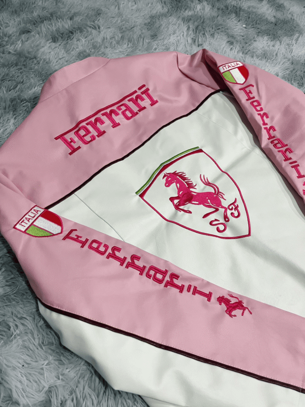 Close-up of premium Italian leather texture on the Limited Edition Pink Ferrari Jacket, highlighting intricate stitching details