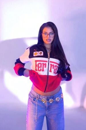 Front view of woman in Exotix Ferrari F1 Racing Streetwear Jacket in studio setting