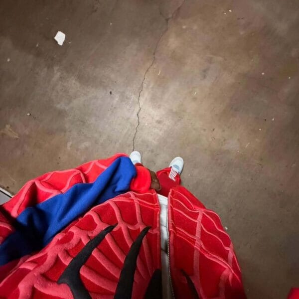 Close-up image of the Spidey hoodie’s chest area showing the black spider logo.