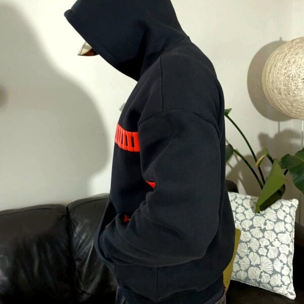 Side view of Exotix I Love You hoodie – black oversized fit with aesthetic romantic design