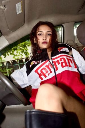 Model wearing Exotix Ferrari Racing Jacket with Scuderia Ferrari and F1 patches – front view in streetwear styling