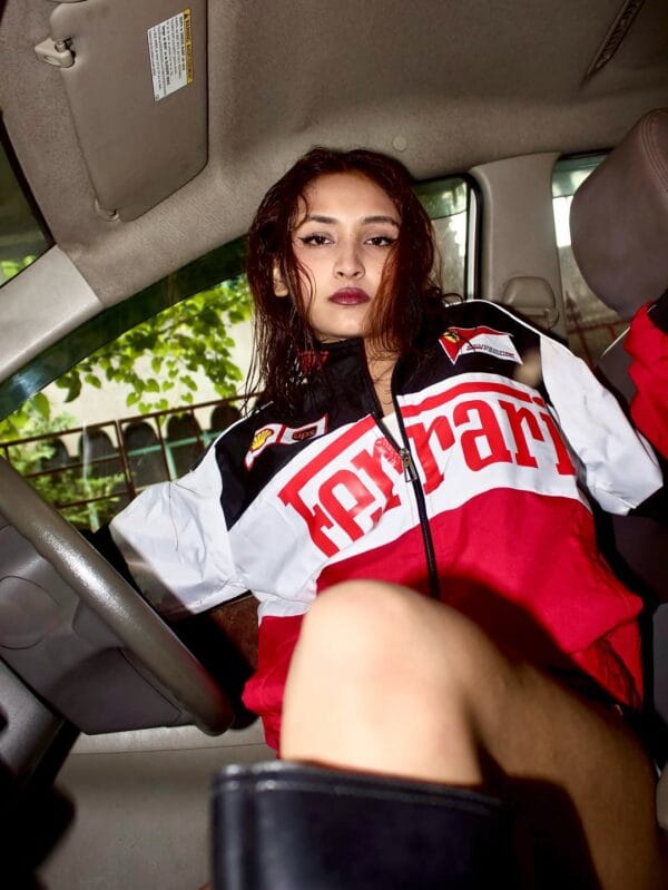 Model wearing Exotix Ferrari Racing Jacket with Scuderia Ferrari and F1 patches – front view in streetwear styling