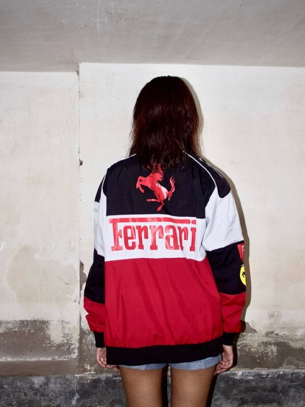 Model flaunting Exotix’s Ferrari Jacket with vintage motorsport vibes – high-quality finish with street aesthetics