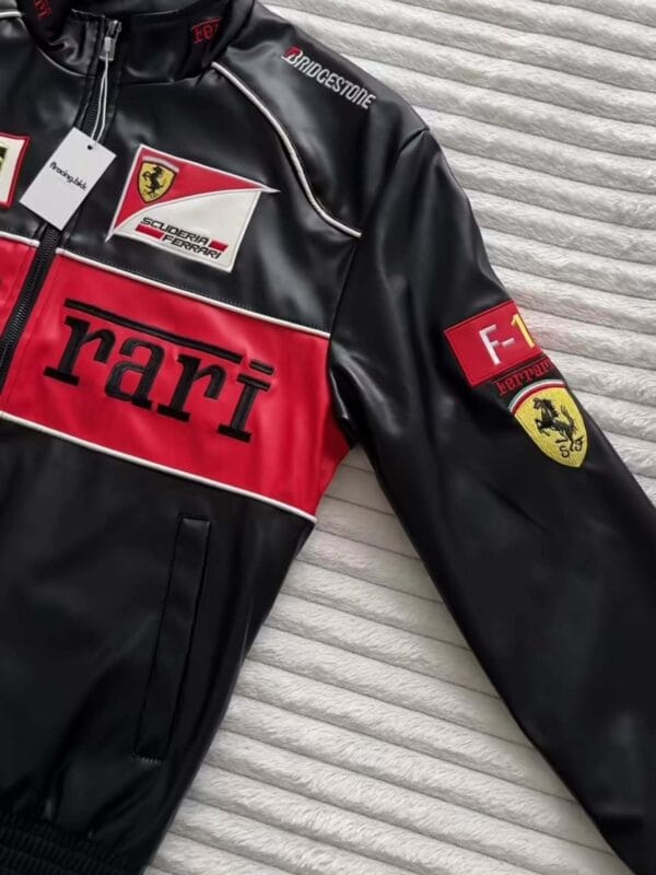 Premium Ferrari F1 leather jacket laid flat with patches and sleek finish – Exotix collection
