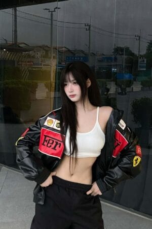 Model posing in premium Ferrari leather jacket showing full front design – Exotix streetwear