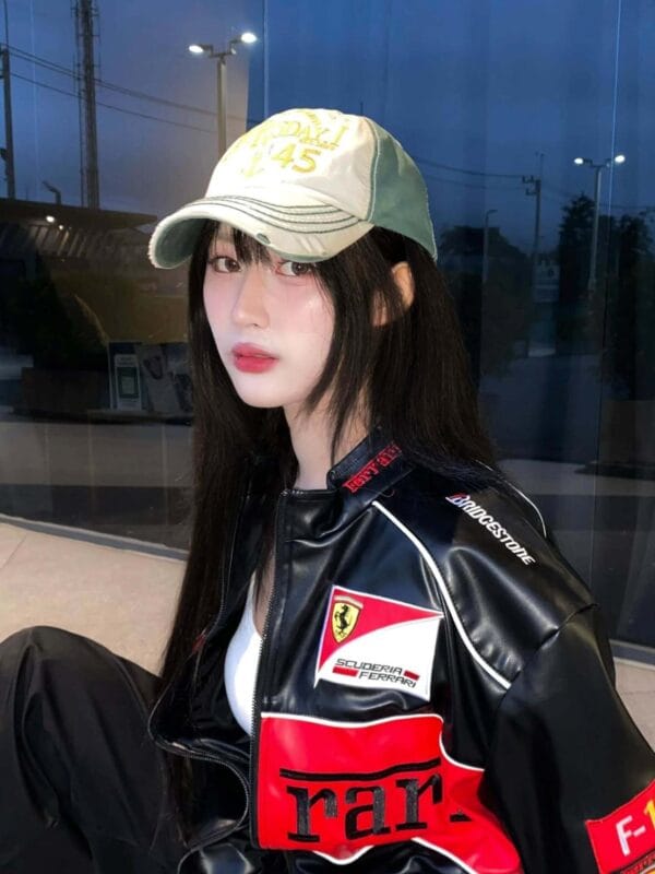 Close-up of Ferrari F1 jacket with Scuderia patch and race-inspired details – Exotix
