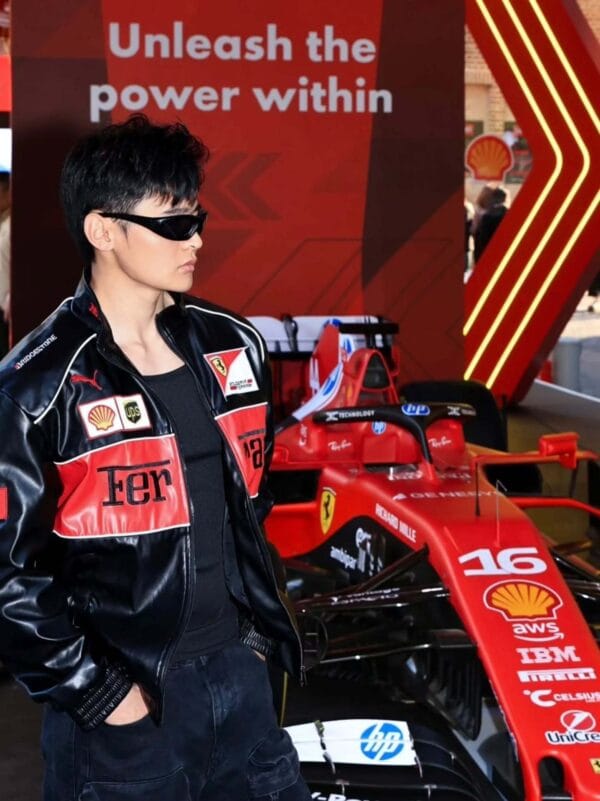 Man wearing Ferrari racing jacket standing in front of F1 race car – Exotix limited edition