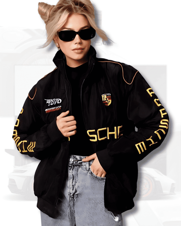 Man in black Porsche F1 streetwear jacket with bold yellow logo and racing-inspired stitching, captured from behind.