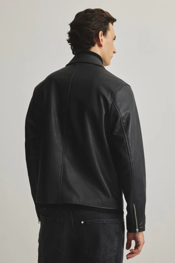 Black leather boxy jacket back view showing structured shoulders and relaxed fit - Exotix faux leather jacket