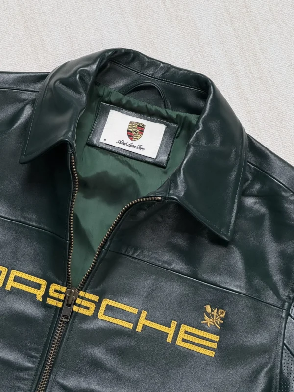 Close-up of handcrafted stitching and Porsche 993 logo on Exotix Leather Jacket