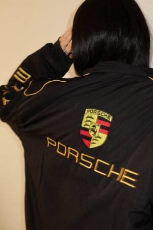 High-quality zipper and embroidery details on Porsche bomber jacket by Exotix