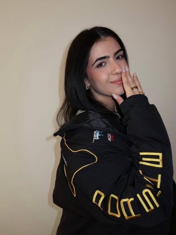 Side view of embroidered Porsche jacket showcasing sleek streetwear fit