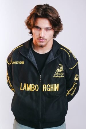 Front view of Exotix Embroidered Racing Lamborghini Jacket in black and yellow worn by male model