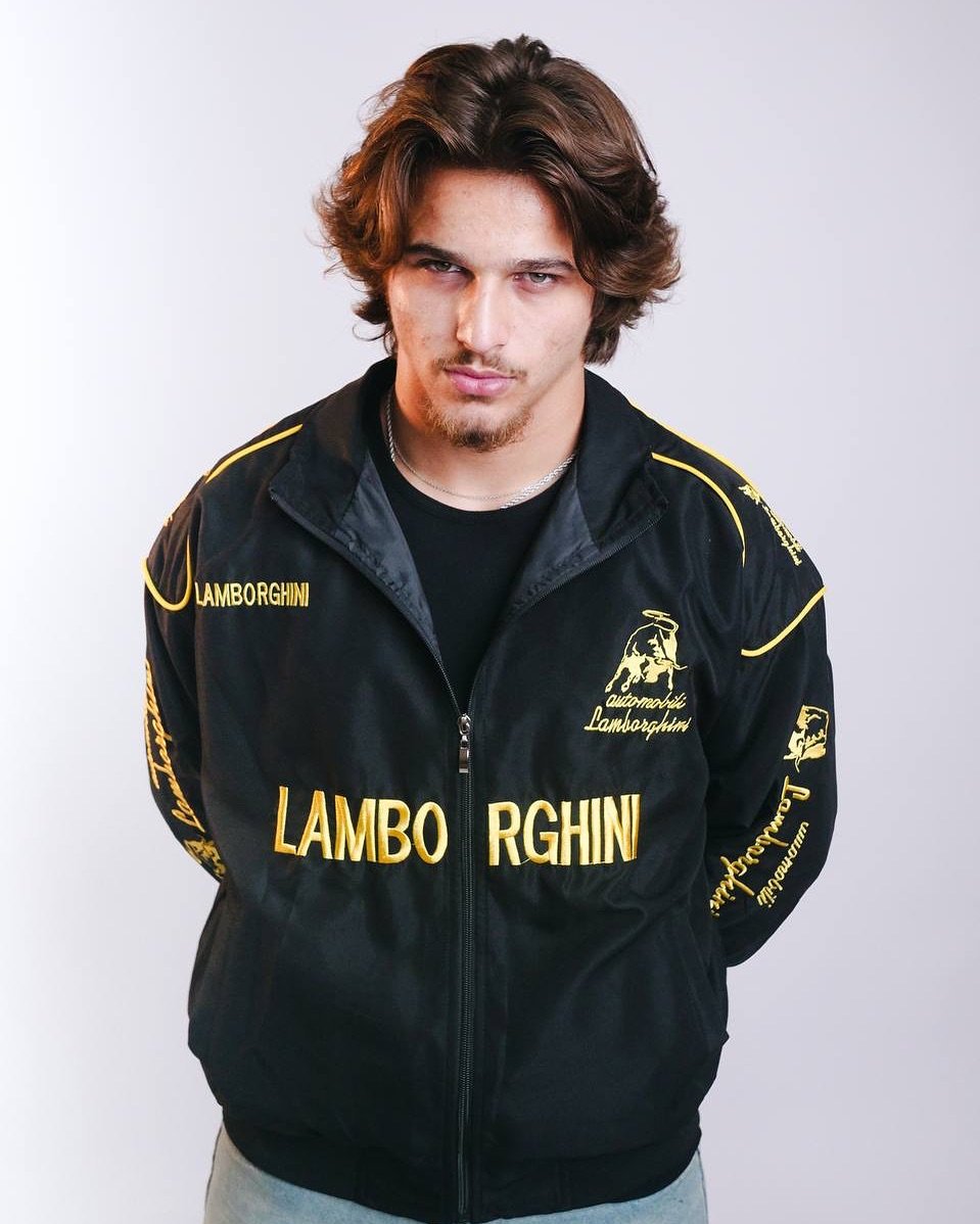 Embroidered Lamborghini Racing Jacket – Premium Racing Apparel Streetwear Front view of Exotix Embroidered Racing Lamborghini Jacket in black and yellow worn by male model