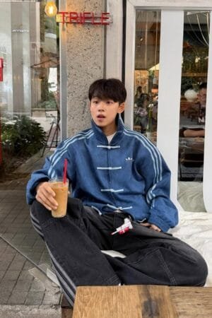 Navy Blue Chinese New Year Jacket styled casually at cafe – trendy lunar new year jacket for men in India