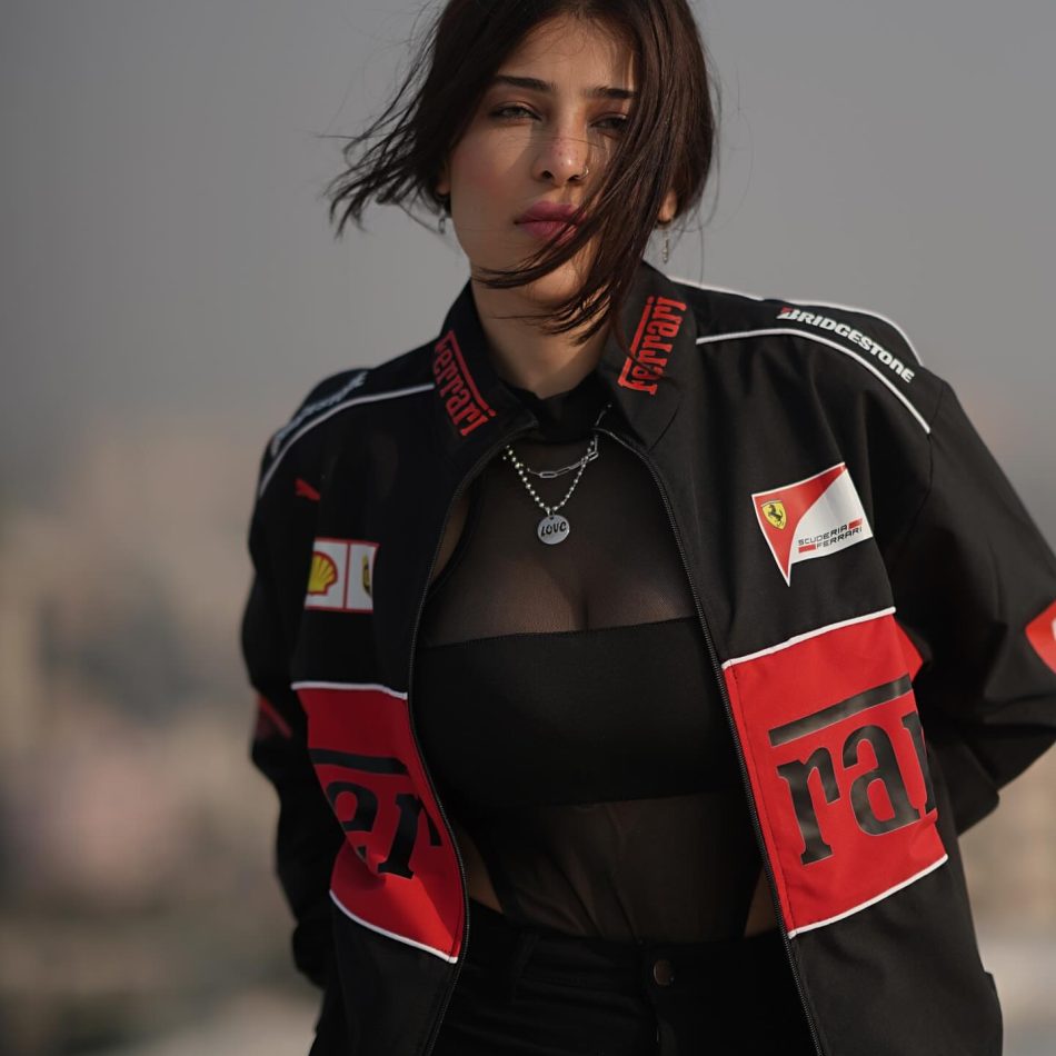 How to Style a Black Ferrari Jacket Like Celebrities in 2025 (With Fabric & Fit Tips) Edin Rose wearing black vintage Ferrari jacket by Exotix